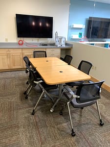 Main Floor Quiet Study setup with 2 tables conference style and 6 chairs
